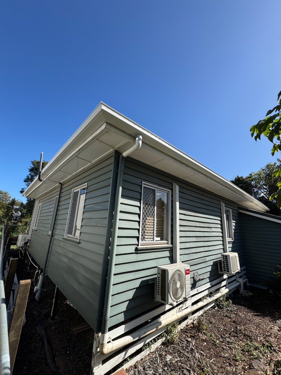 White gutter, fascia and downpipe on a weatherboard home