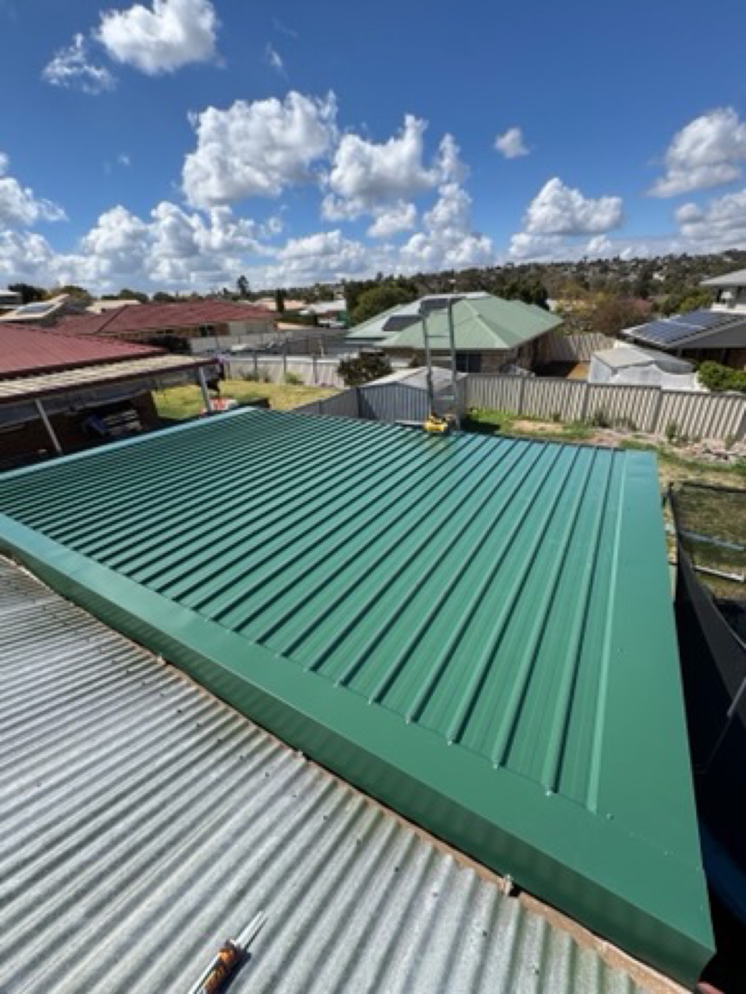New green metal roof section