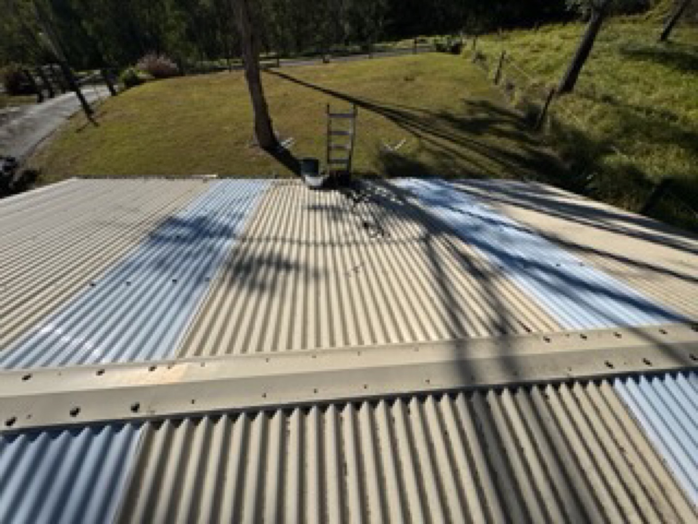Weathered corrugated metal roof on a rural home